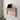 Invisible wall-mounted folding table in a sleek white design, folded and tucked against a minimalist wall for space-saving efficiency.