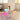 Oval-shaped iridescent acrylic coffee table with geometric support legs, offering a dynamic colour-changing surface. A stylish and functional piece for any contemporary home, perfect for holding décor, books, or a vase in living rooms, bedrooms, or lounges.