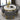 Scandinavian-style round dining table made from stone and marble.