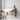 Space-saving, invisible wall-mounted folding table in a light wood finish, extended to create a practical working or dining surface.