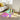 Stylish iridescent coffee table with an oval acrylic top that shifts colours, supported by four sleek geometric legs. Perfect for adding a touch of modern elegance to any living room or bedroom, with a spacious surface for books, vases, and décor.